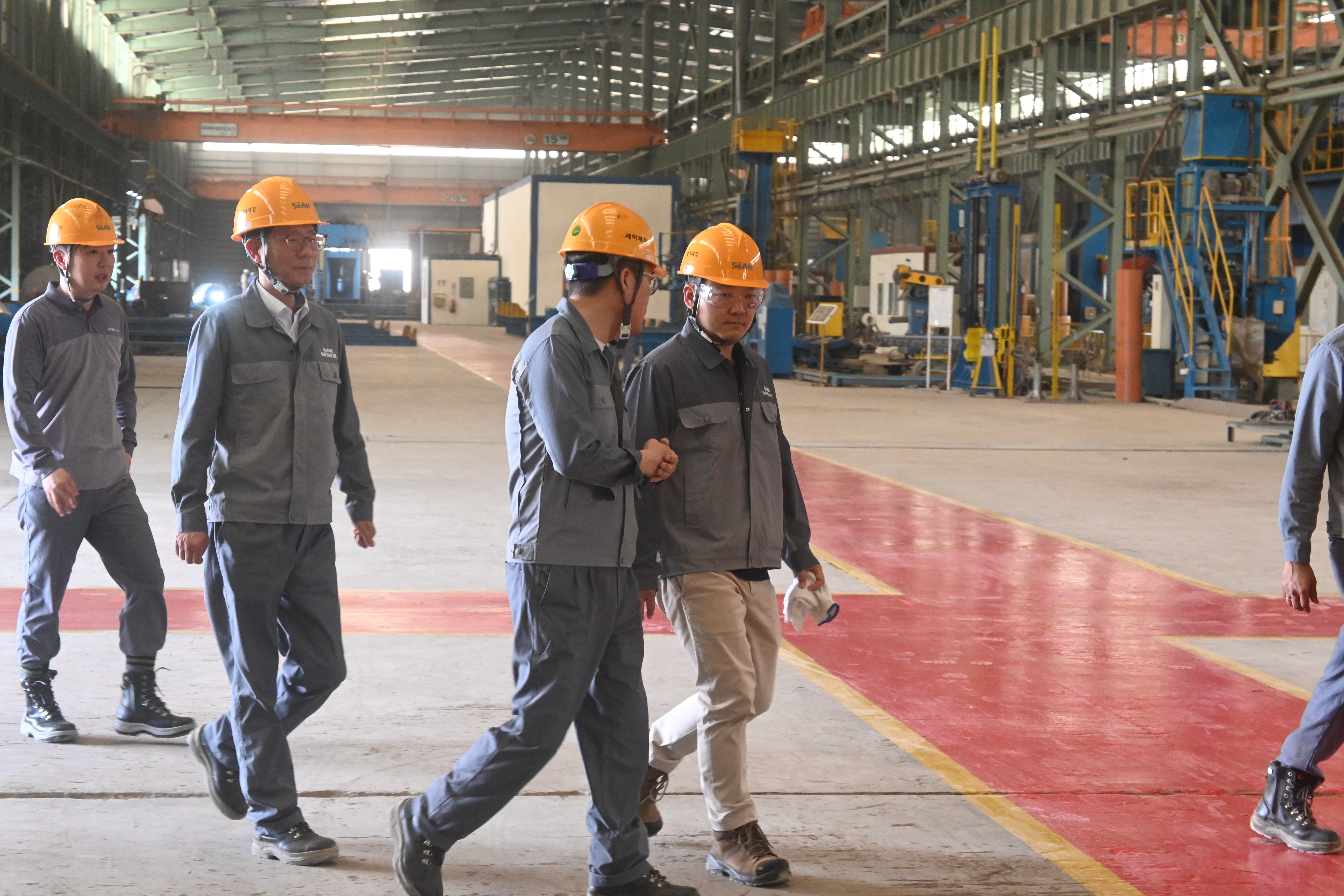 Cutting the celebratory cake with employees